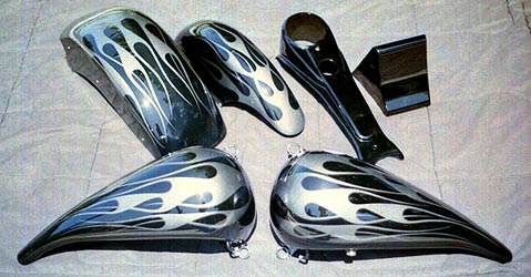 silver flames on black motorcycle parts