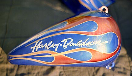 flames and hand lettering on motorcycle tank
