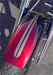 red and silver graphics on black motorcycle fender