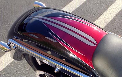 red and silver graphics on black motorcycle rear fender