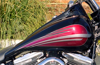 red and silver graphics on black Harley Davidson motorcycle tank