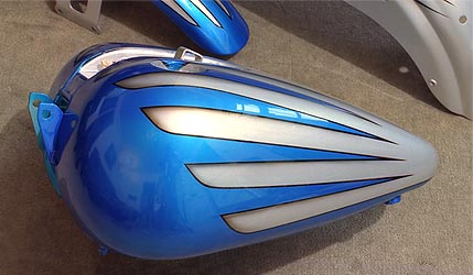 candy blue scallops on silver Harley Davidson motorcycle