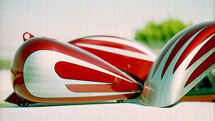 silver scallops on candy red Harley motorcycle parts